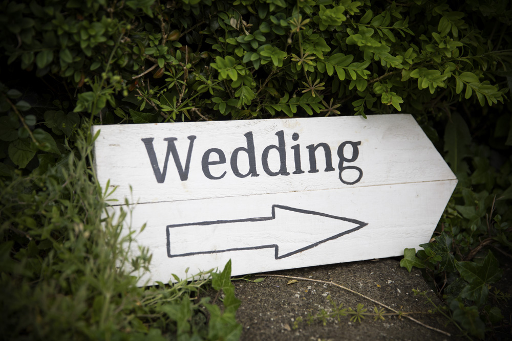 wedding photographer image of a sign with the word wedding written on it