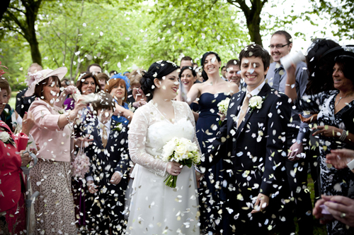 wedding photographer image of bride and groom with confetti